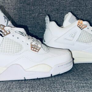 All white Jordan 4s